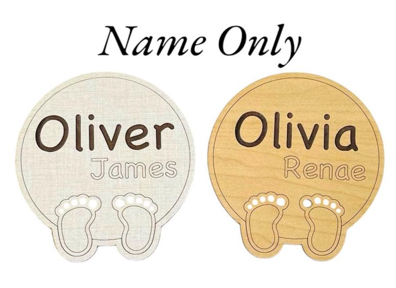 Baby birth announcement with the first and middle names engraved. Cute baby feet and laser-cut toes at the bottom of the round sign. Linen or maple wood options. From Art by Iceberg, a female-owned small business in Colorado.