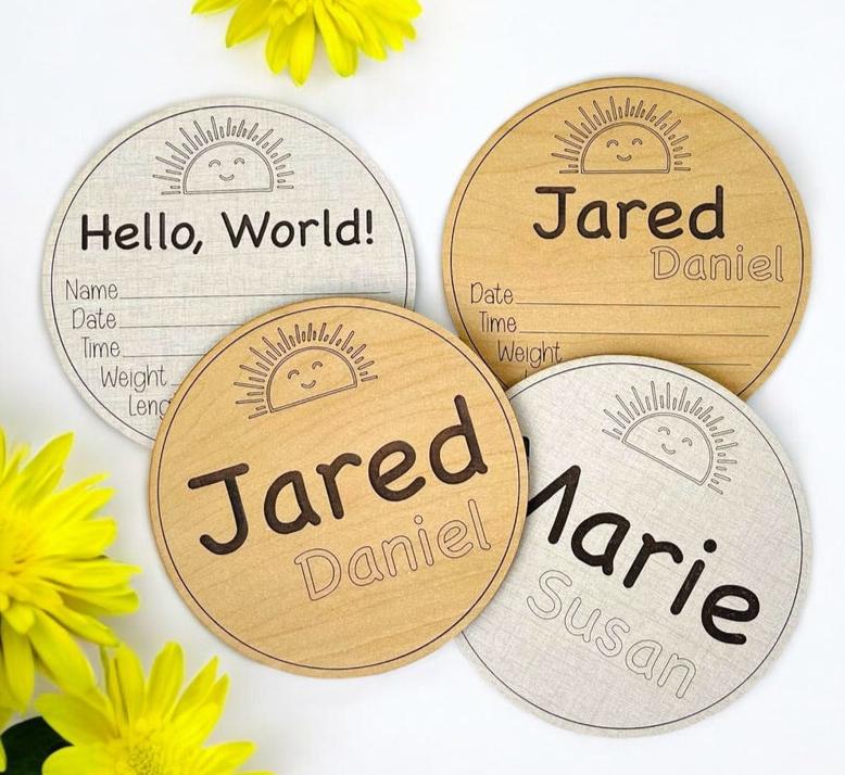 Boho sunshine smiling sun baby birth announcement sign. Engraved sun at the top, engraved baby first and middle name, and an area for birth stats below. Five inches round, choose linen or maple wood. Ideal baby shower gift for a photo prop.