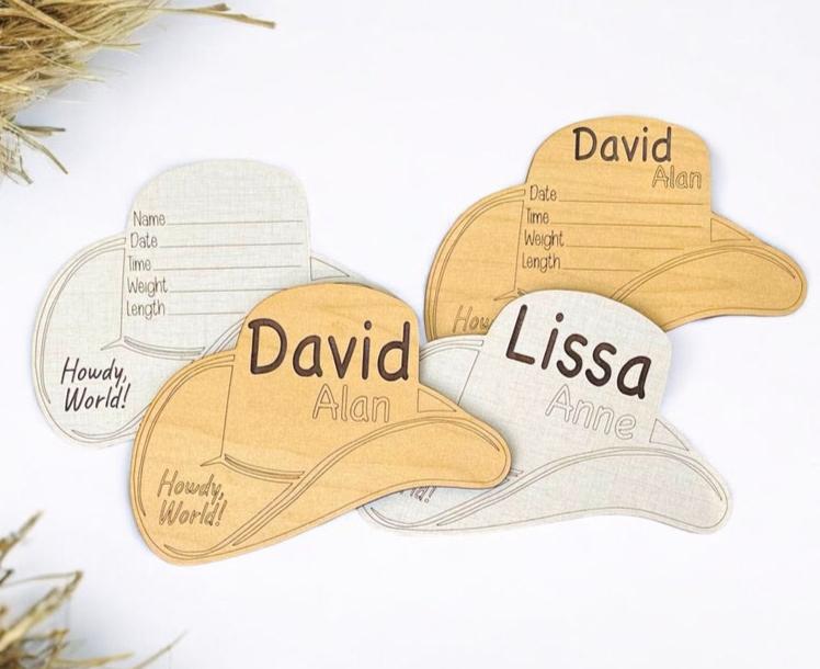 Baby birth stats announcement. Shaped like a cowboy hat. Says Howdy, world on the brim, and the hat has name and birth stat areas for you to fill in. Cute photo prop for any southern, western, cowboy fan! From Art by Iceberg.